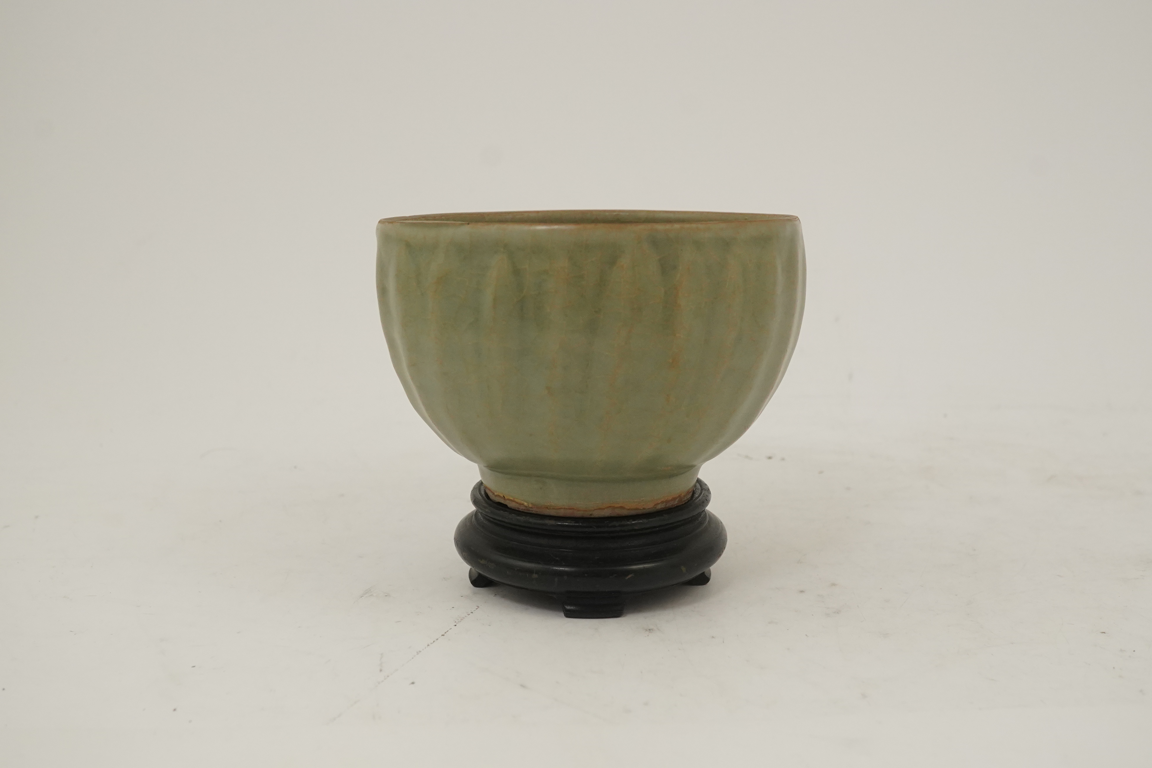 A Chinese Longquan celadon petal lobed deep bowl, Southern Song/Yuan dynasty, 13th century